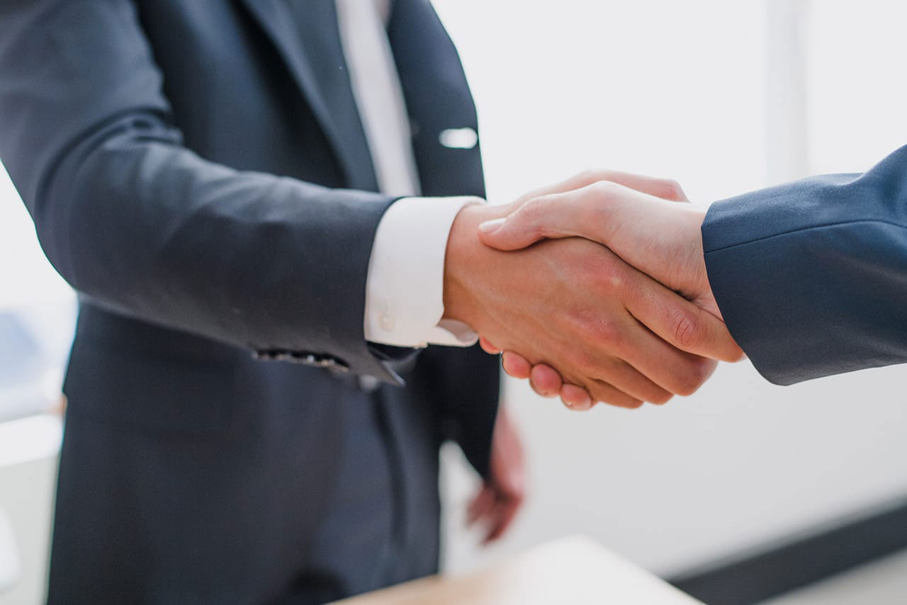 Businessmen shaking hands after a successful business deal