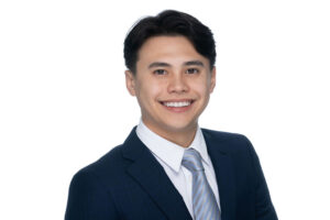 Younger financial advisor in a dark suit with blue tie